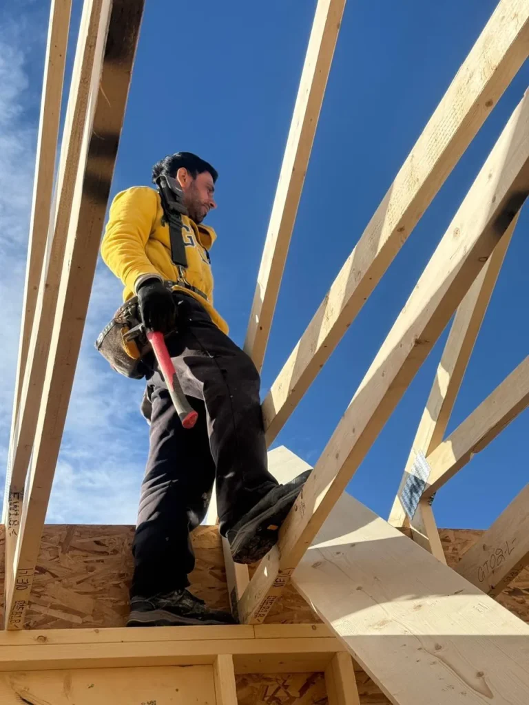 wood framing team member working